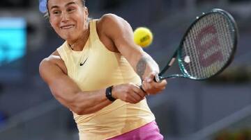 Aryna Sabalenka crushes a backhand during her hard-fought win over Danielle Collins in Madrid. (AP PHOTO)